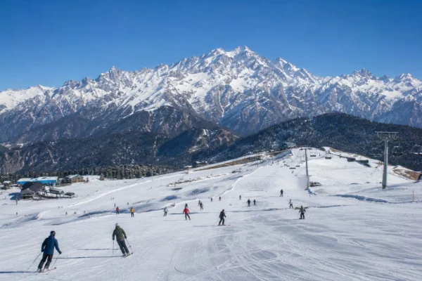 Scenic winter slopes at Auli Ski Resort with Nanda Devi peak in Uttarakhand
