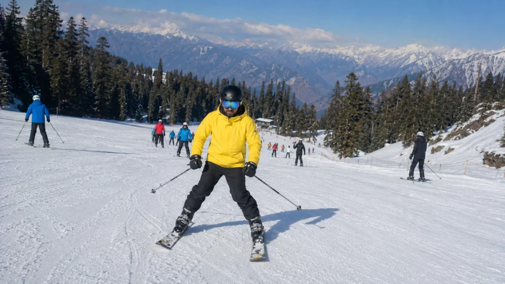 A beginner skier practicing snowplough turns on a groomed slope in Auli