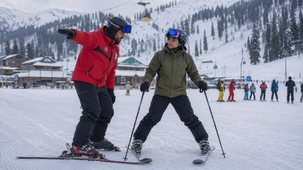 A certified ski instructor teaching a beginner skier on a snowy slope in India