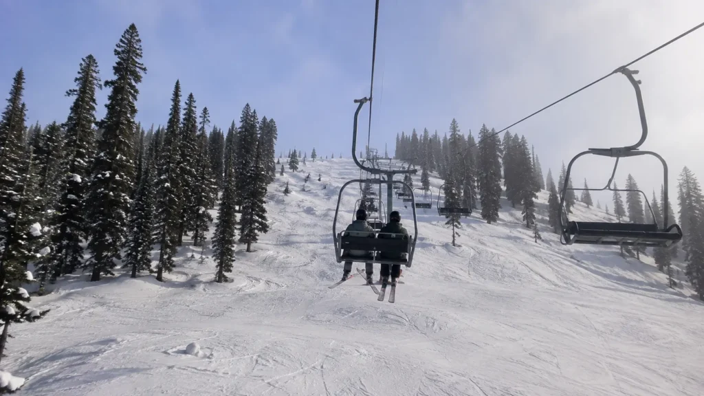 Skiers riding the chairlift to the mid-station runs in Gulmarg