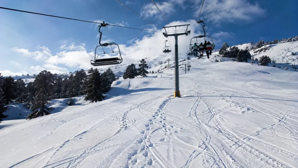 The ski chairlift operational above the snowy runs in Auli